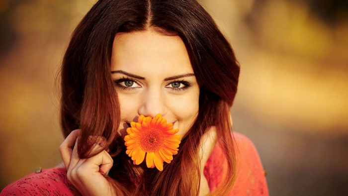 Girl with orange flower