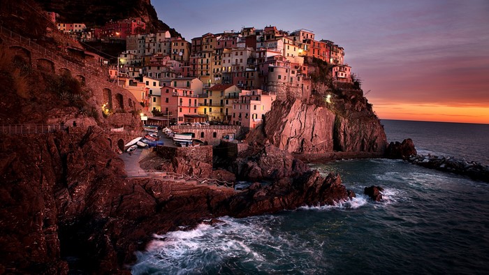 Manarola village on a cliffside at sunset