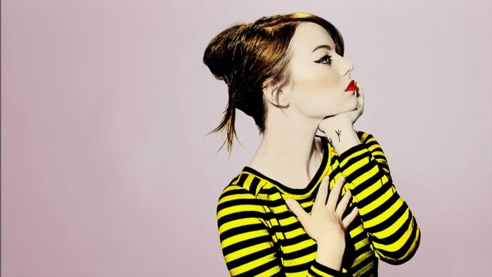 Emma Stone in yellow and black striped shirt