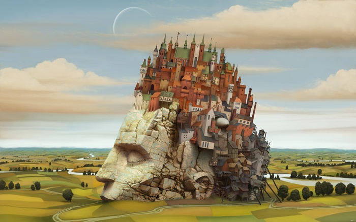 City built on a giant stone head in a landscape