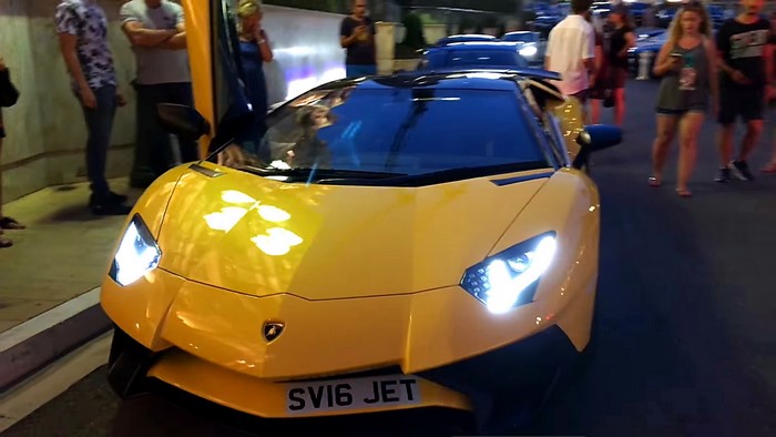 Yellow Lamborghini Aventador SV with license plate SV16 JET