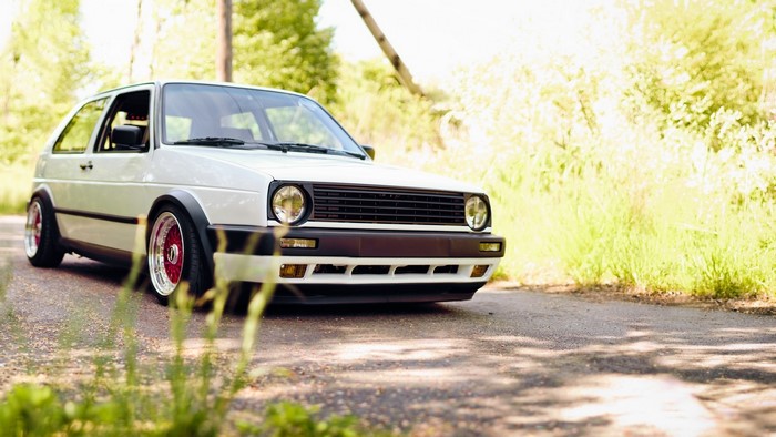 White Volkswagen Golf GTI on a road