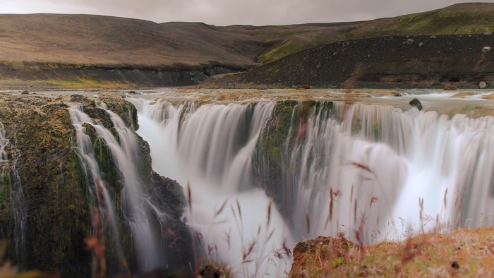 Waterfall cascade in a barren landscape