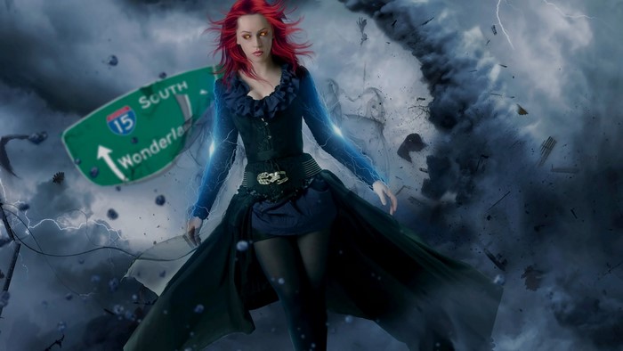 Woman with red hair and blue lightning