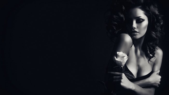 Woman holding a white rose