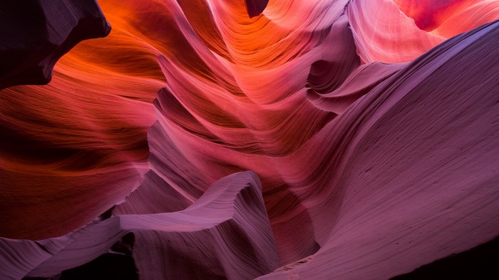 Antelope Canyon rock formations with orange and purple hues