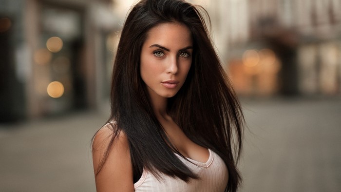 Woman with long dark hair and green eyes