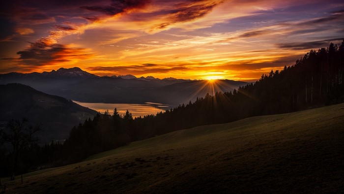 Sunset over mountains and lake