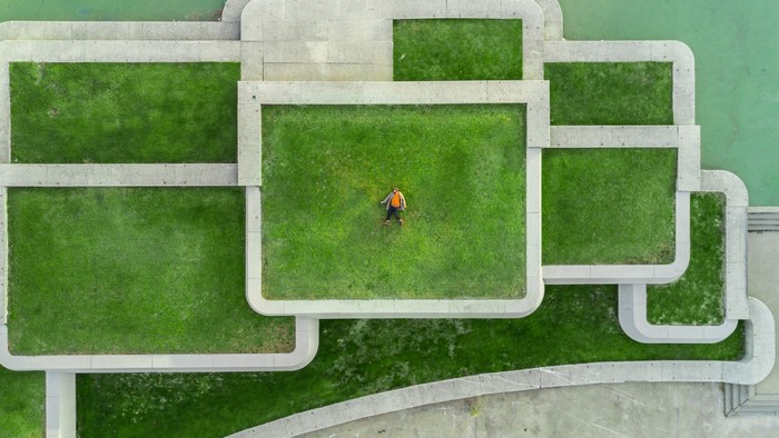 Man lying on grass in Montreal, Canada