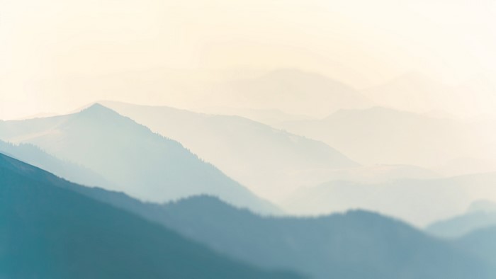 Mountain peaks in fog