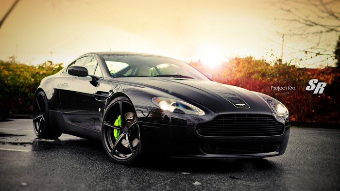 Black Aston Martin Vantage on Wet Road