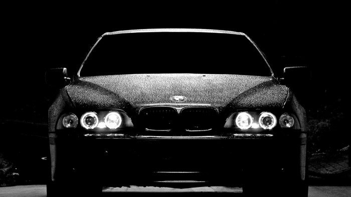 Front view of a wet BMW car at night