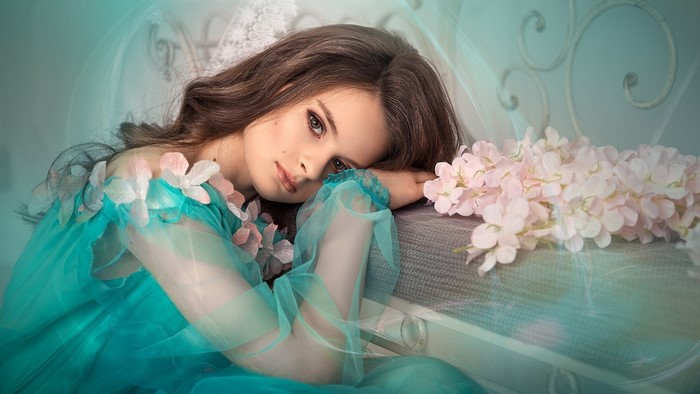Girl in a turquoise dress with flowers