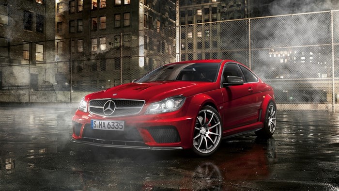 Red Mercedes-Benz C63 AMG Coupe on Wet Pavement