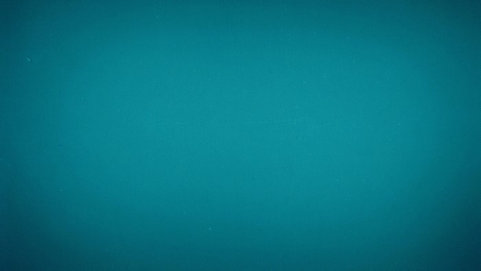 Teal textured surface with subtle lighting