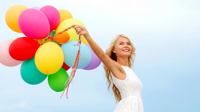 Girl with colorful balloons