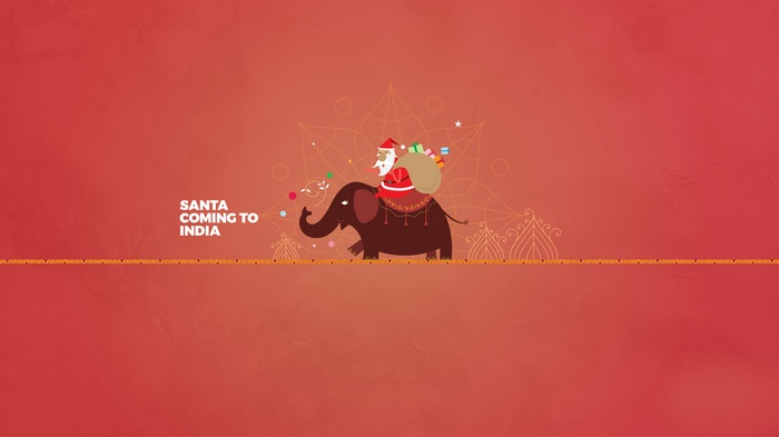 Santa Claus riding an elephant with gifts, "Santa Coming to India"