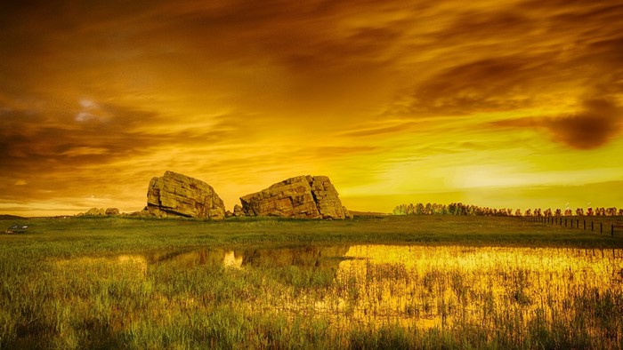 Golden Sunset Over Rocky Landscape