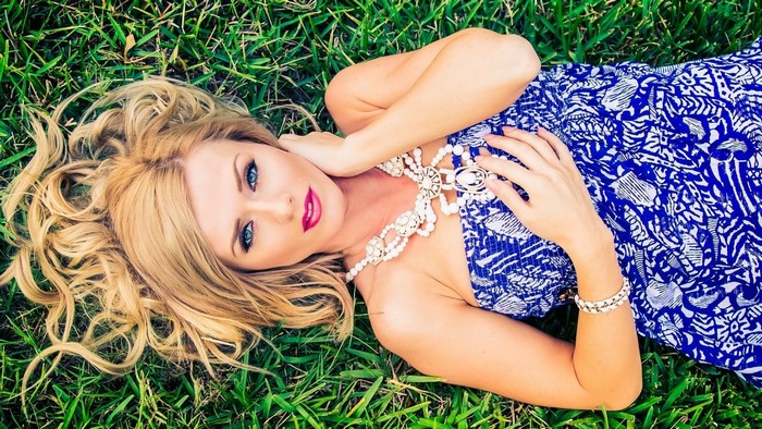 Aida Ridic lying on grass