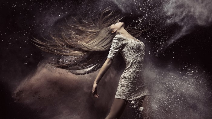 Woman dancing with powder