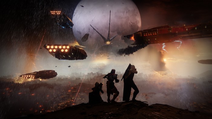 Guardians overlooking a city under siege in Destiny 2