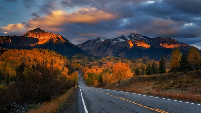 Mountain road during autumn sunset