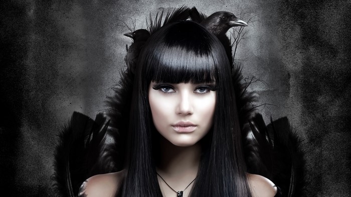 Gothic woman with black hair and crows