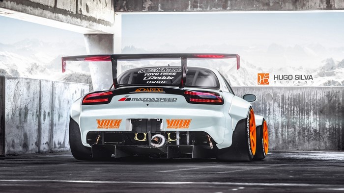 White Mazda RX-7 with large rear wing and racing decals