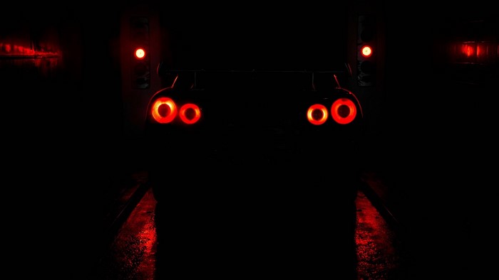 Nissan Skyline GT-R R34 taillights in darkness