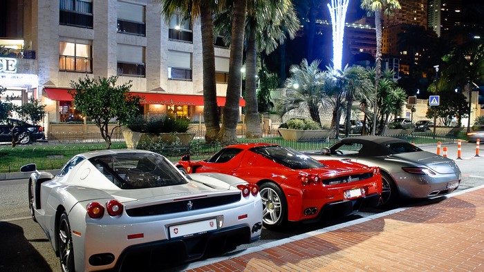 Ferrari Enzo and Mercedes-Benz SLS AMG parked at night