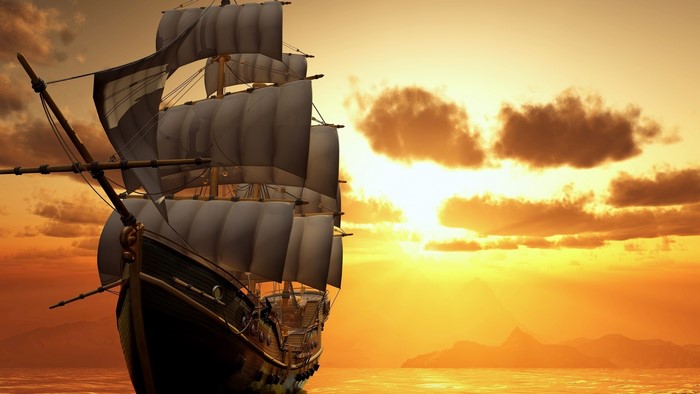 Sailboat sailing at sunset