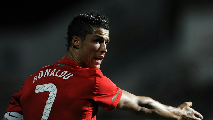 Cristiano Ronaldo wearing a red Manchester United jersey
