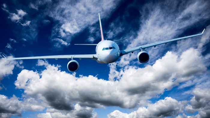 4K Airliner flying through clouds