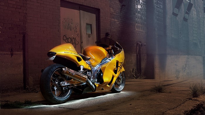 Yellow Suzuki Hayabusa motorcycle in alley