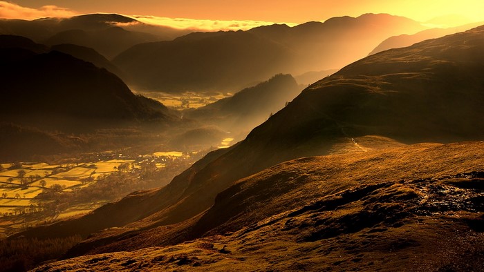 Mountains with fog at sunset