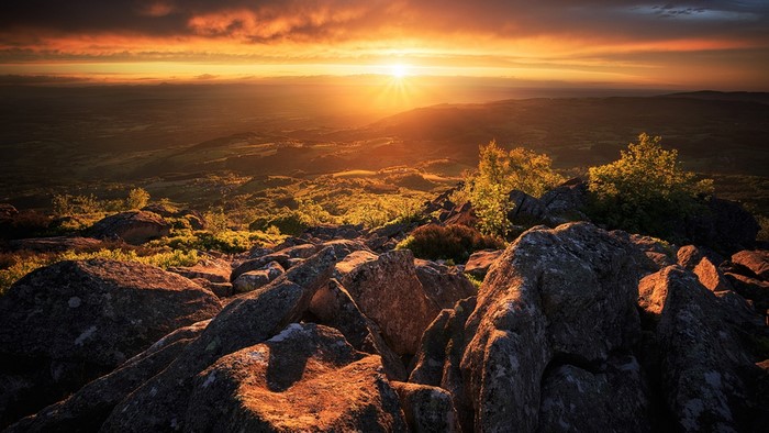 Sunset over rocky hills