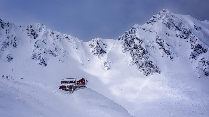Wooden cabin in snowy mountains, Romania