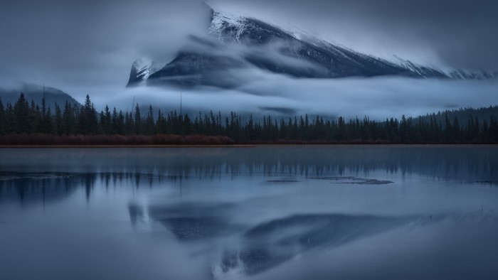 Misty Mountain Reflection Over Lake