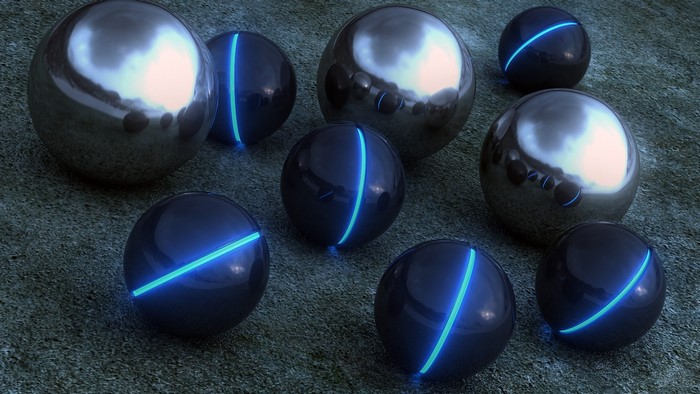 Chrome and glowing blue balls on textured ground