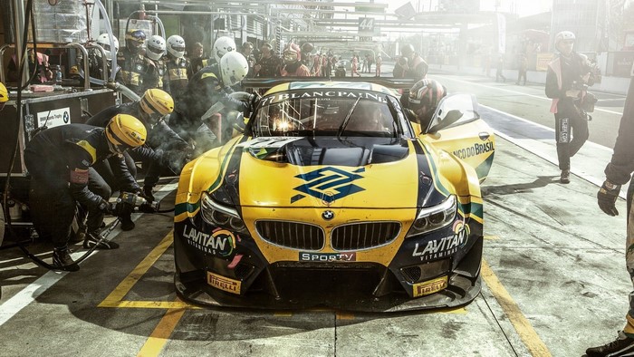 BMW race car pit stop with crew
