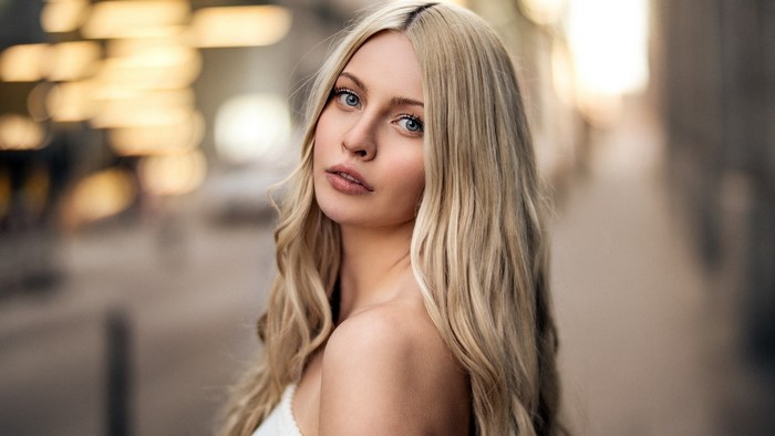 Woman with blonde hair by Martin Kuhn