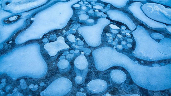 Frozen lake with trapped air bubbles
