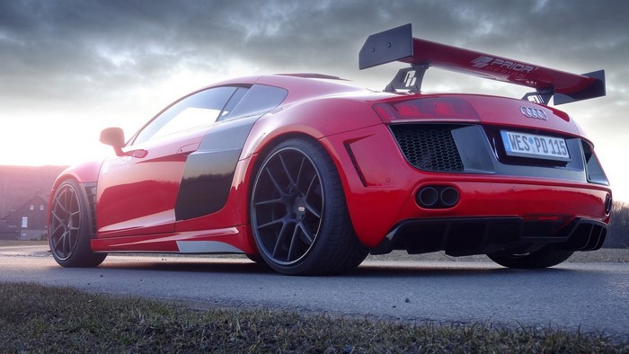 Red Audi R8 with a large rear spoiler