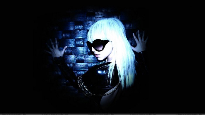 Lady Gaga with blonde hair and sunglasses