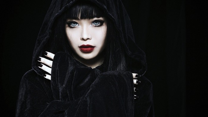 Girl in black hooded robe