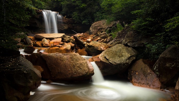 Waterfall cascading over rocks in a forest