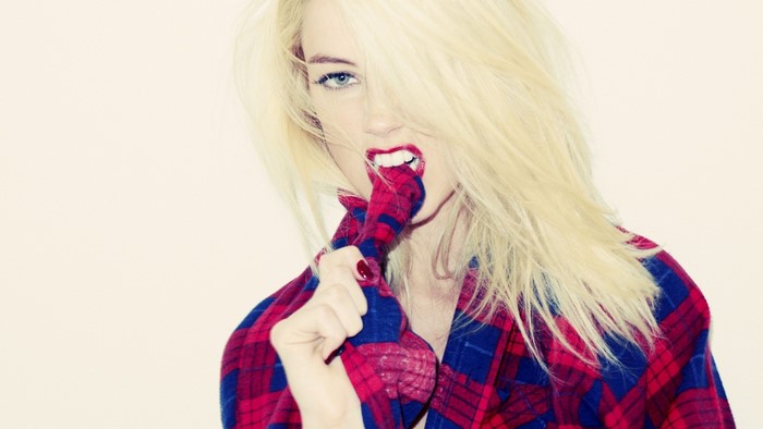 Amber Heard biting her plaid shirt