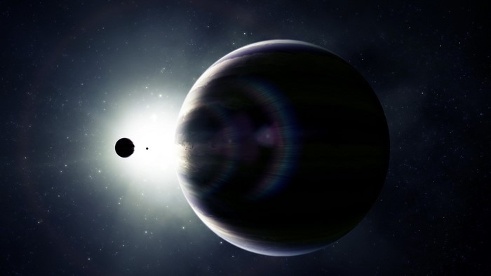 Planet and moon eclipsing a star in space