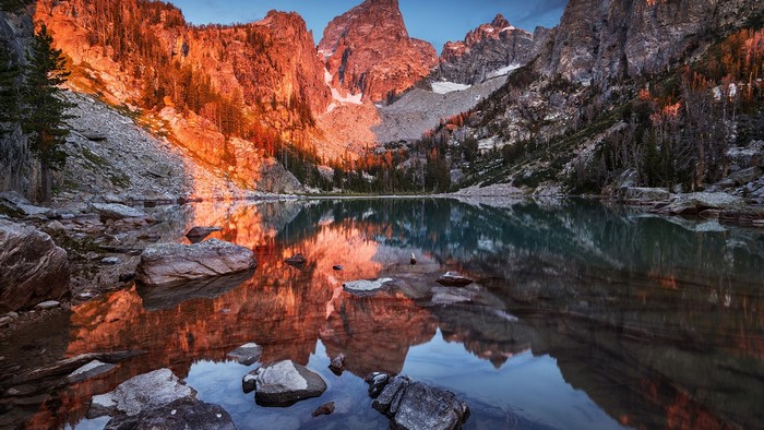 Mountain lake reflecting sunset light