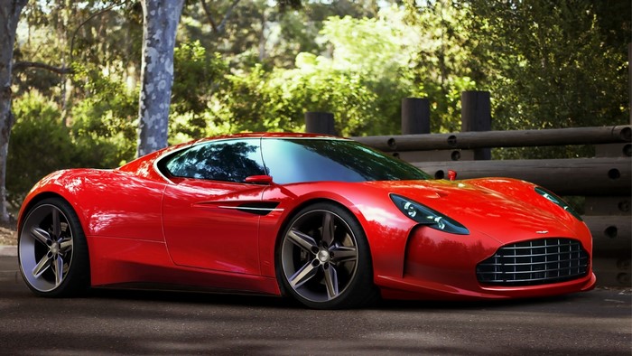 Red Aston Martin sports car parked outdoors